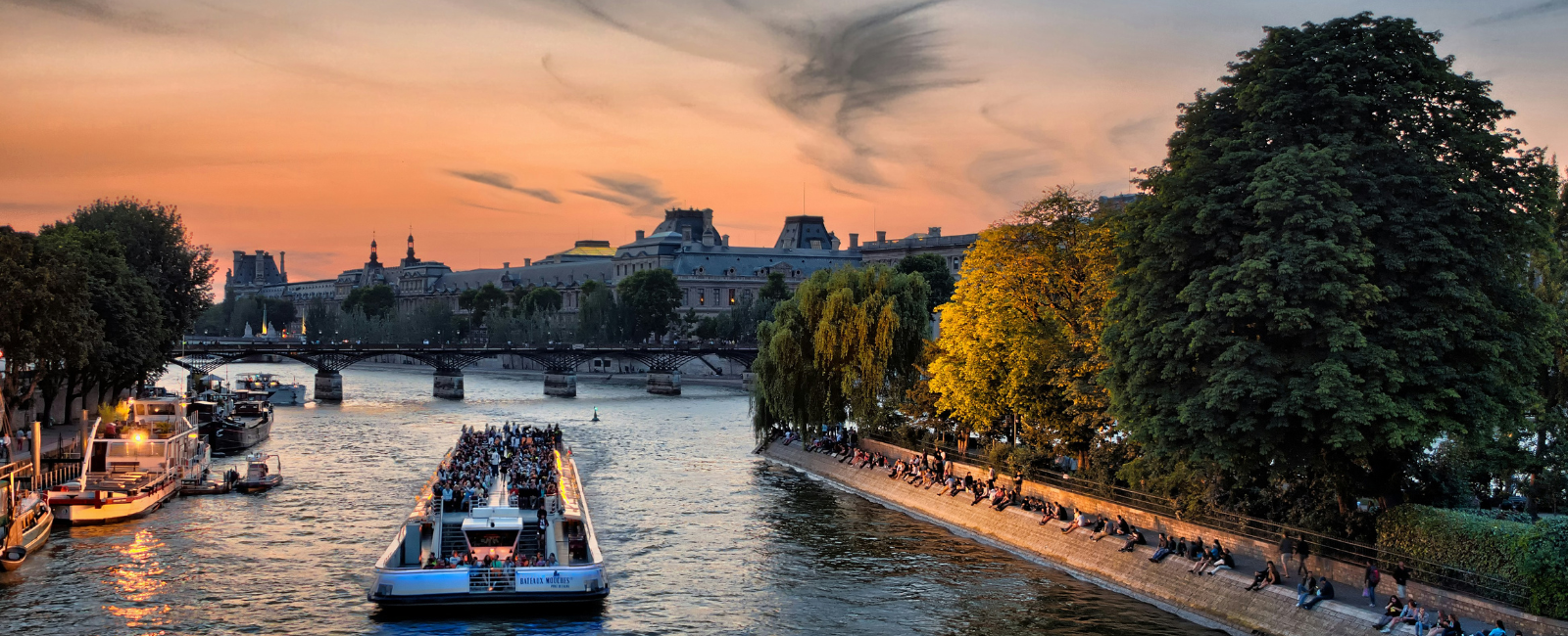 Tour boat along the Seine at sunset